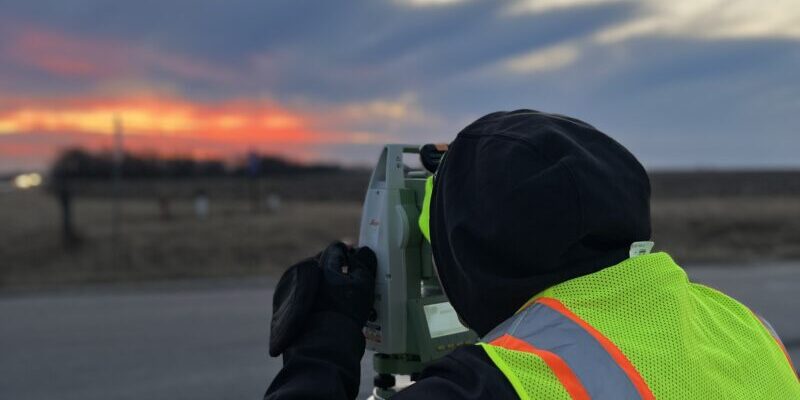 Accident reconstruction expert documenting collision evidence.